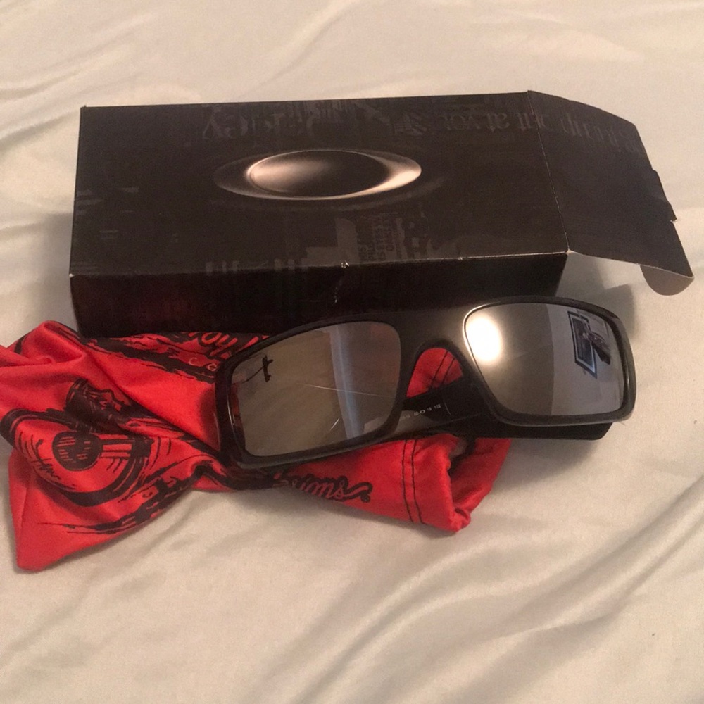 Brand New Oakley polished Black sunglasses